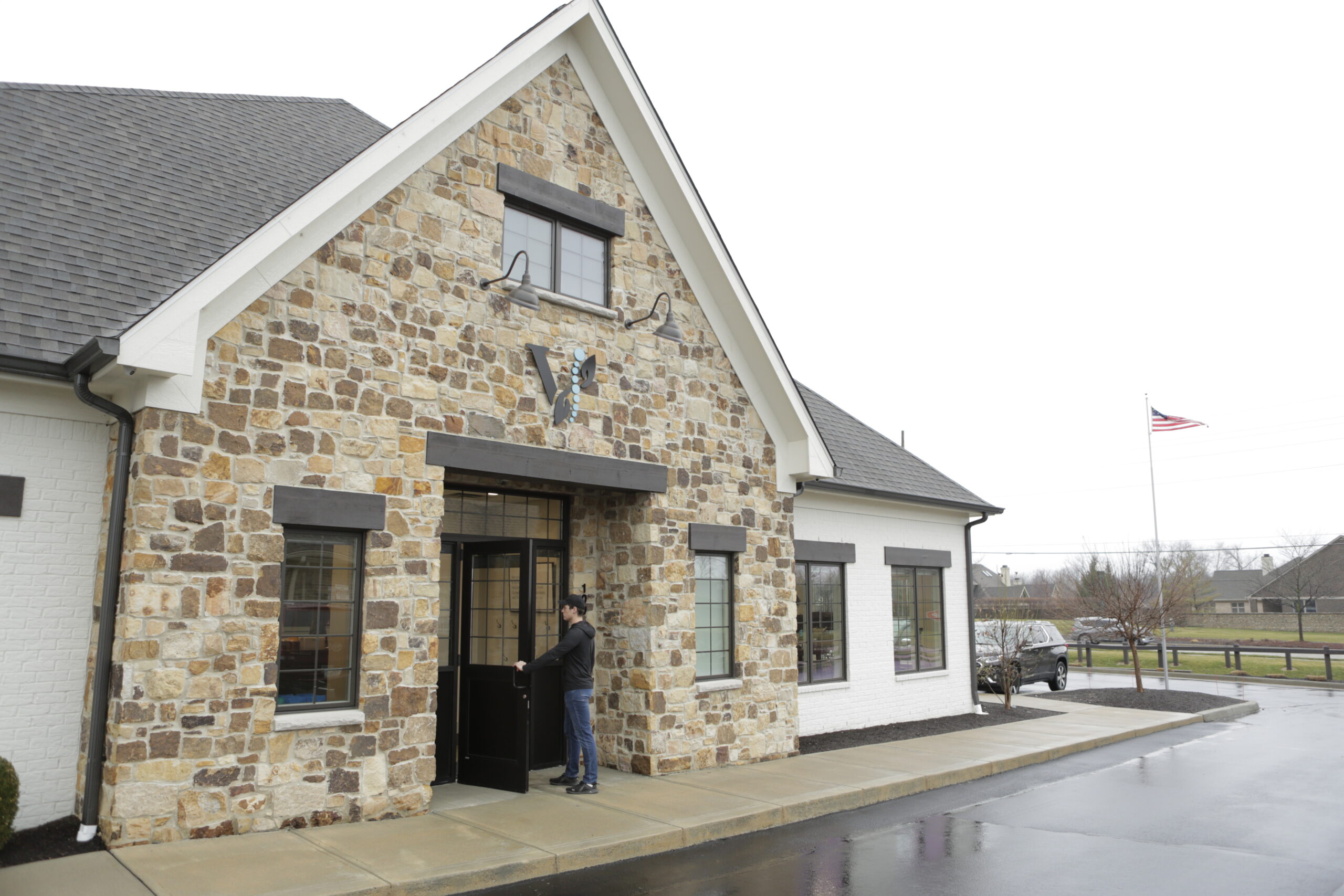 Fishers, IN chiropractic clinic exterior near 116th Street with welcoming entrance and clear daytime lighting. 