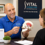 TMJ headache relief consultation in Fishers, IN with a chiropractor explaining jaw tension, tmj headache relief, tmj headaches, jaw tension headache relief,
