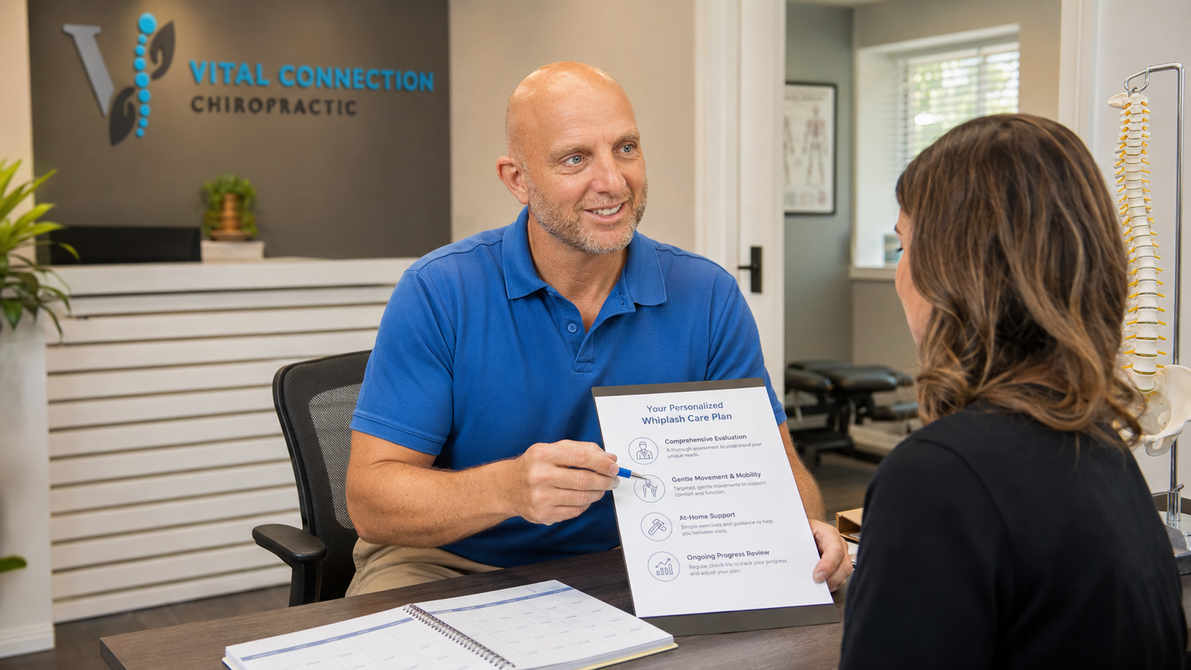 Doctor Jarred reviewing whiplash chiropractic care at Vital Connection Chiropractic in Fishers, IN, can chiropractor help with whiplash, does chiropractic help whiplash, whiplash chiropractic care,